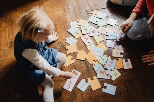 Child learning with educational puzzles during homeschool.