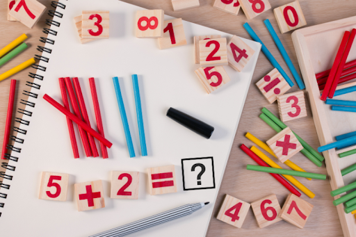 Hands-on math learning activity with numbers and counting sticks.