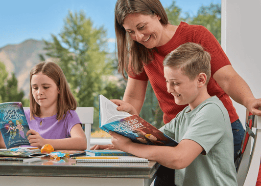 Mother helping children read books during homeschooling.