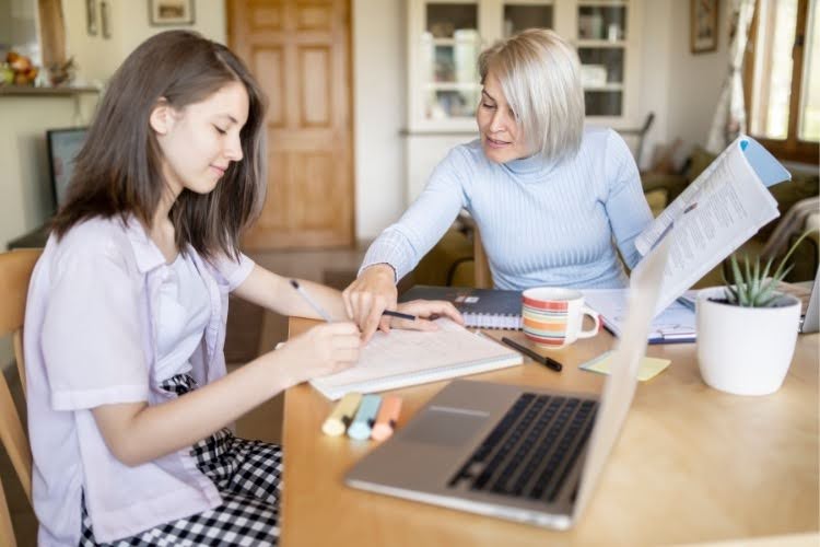 Parent helping student with homeschooling in Connecticut.