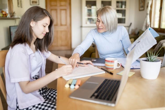 Parent helping student with homeschooling in Connecticut.