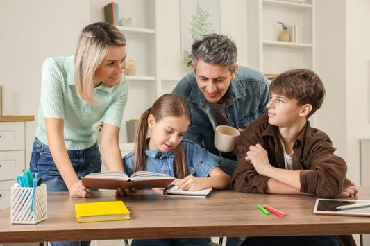 Parents helping children follow their homeschool schedule at home.
