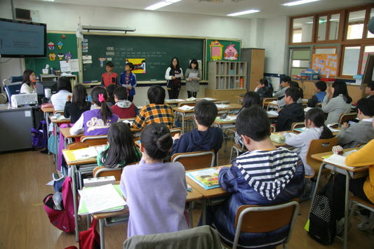 Students learning in a traditional high school classroom.