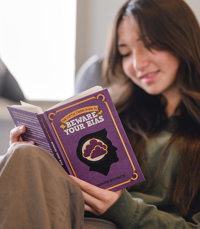 Teen reading Beware Your Bias